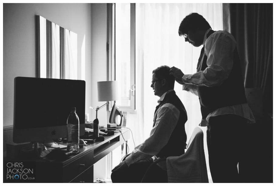 Doubletree by Hilton Wedding Photographer Leeds City Centre Wedding by Chris & Hazel Wedding photography - Tina & Sam 023 bestman doing grooms hair, bestman groom helping get ready, groom getting ready, groom preps