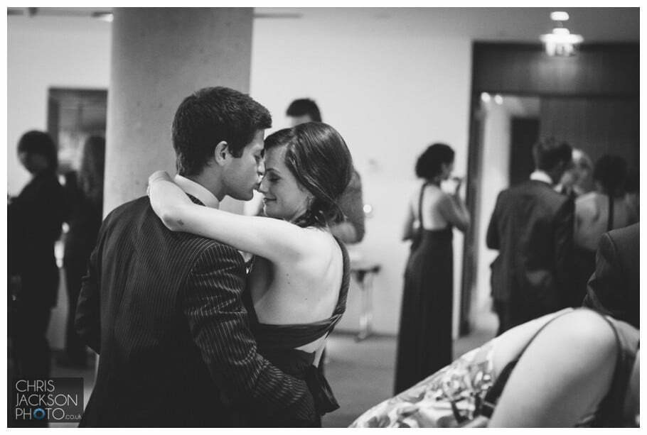 Doubletree by Hilton Wedding Photographer Leeds City Centre Wedding by Chris & Hazel Wedding photography - Tina & Sam 124 boy girl kissing wedding guests tender moment documentary wedding photography