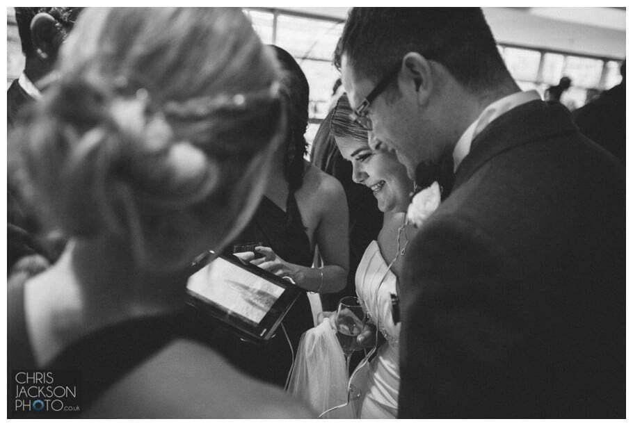 Doubletree by Hilton Wedding Photographer Leeds City Centre Wedding by Chris & Hazel Wedding photography - Tina & Sam 129 bride and groom skype guest who could not make it to wedding video call on wedding day