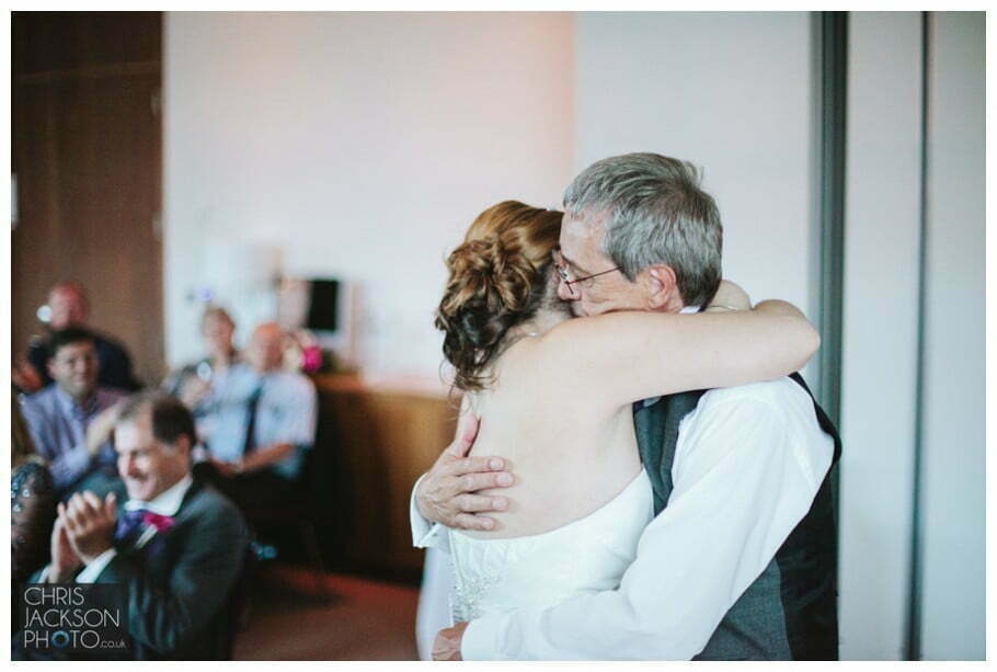 Doubletree by Hilton Wedding Photographer Leeds City Centre Wedding by Chris & Hazel Wedding photography - Tina & Sam 135 bride hugging dad after father of the bride speech