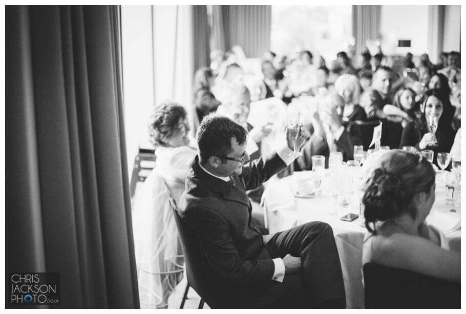 Doubletree by Hilton Wedding Photographer Leeds City Centre Wedding by Chris & Hazel Wedding photography - Tina & Sam 146 groom raising glass to best man speech at wedding leeds photography