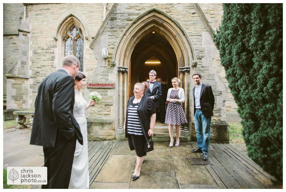 York Castle Museum Wedding Photographer York - Chris & Hazel Wedding Photography - Rory Dalgliesh & Rebecca Weinkauf 055 bride groom wedding church guests family congratulating york heslington church wedding day weddings documentary york wedding photographer chris and hazel wedding photography