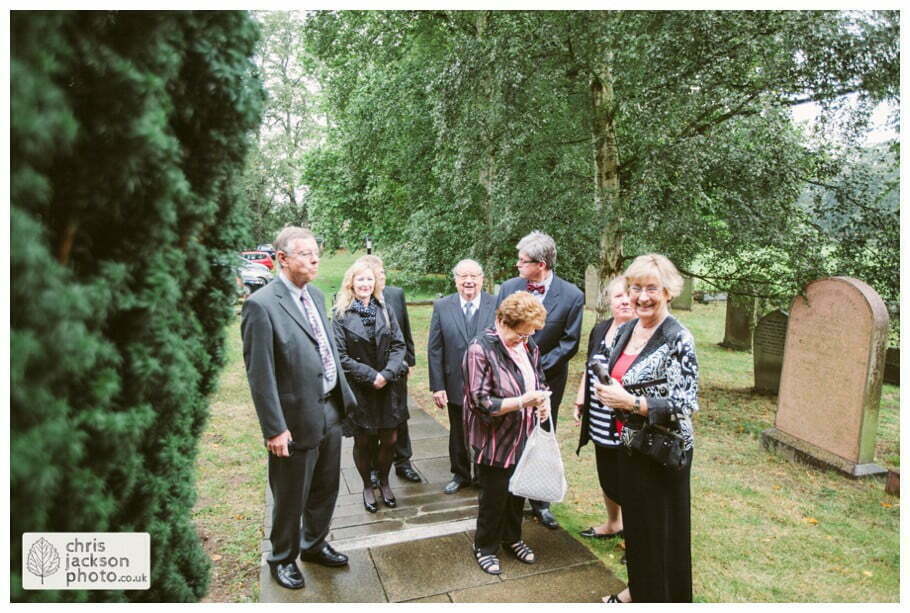 York Castle Museum Wedding Photographer York - Chris & Hazel Wedding Photography - Rory Dalgliesh & Rebecca Weinkauf 057 bride groom wedding church guests family congratulating york heslington church wedding day weddings documentary york wedding photographer chris and hazel wedding photography