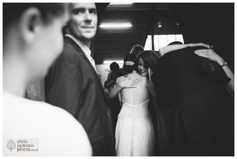 York Castle Museum Wedding Photographer York - Chris & Hazel Wedding Photography - Rory Dalgliesh & Rebecca Weinkauf 058 bride groom wedding church guests family congratulating york heslington church wedding day weddings documentary york wedding photographer chris and hazel wedding photography