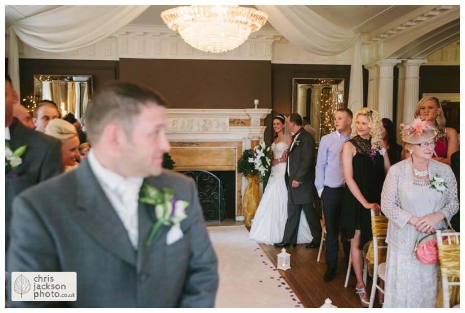 bride and father of bride walking down aisle into wedding ceremony room ballroom documentary reportage Eaves Hall Wedding Photographer Lancashire Clitheroe Wedding Photography by Chris & Hazel Wedding Photography - Steph Blight Steph Duxbury & Iain Duxbury