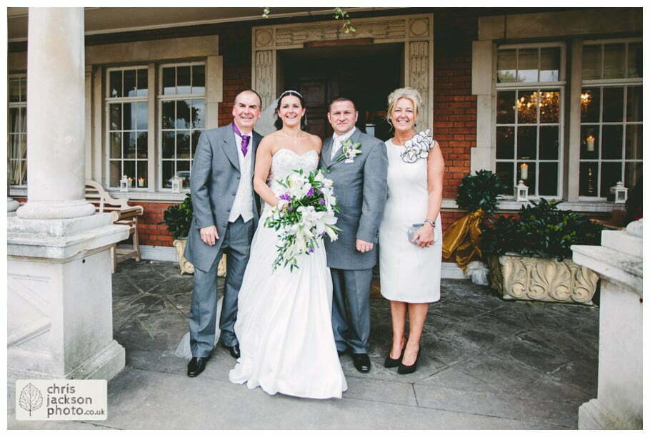 bride and groom and brides parents formal wedding photograph outside Eaves Hall Wedding Photographer Lancashire Clitheroe Wedding Photography by Chris & Hazel Wedding Photography - Steph Blight Steph Duxbury & Iain Duxbury