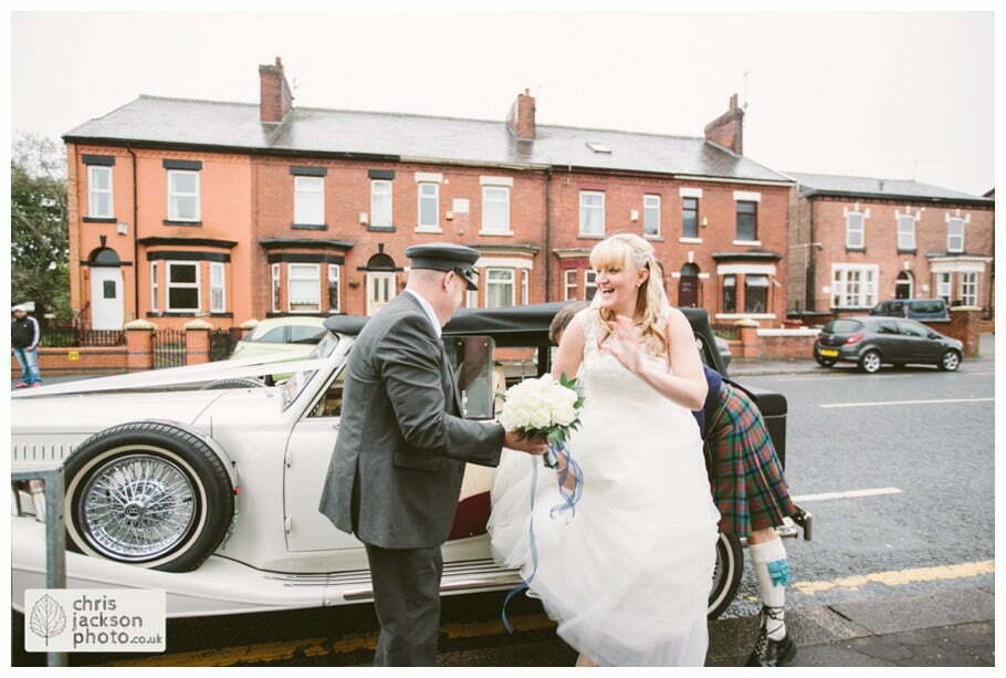 Manchester Wedding Photographer St Anne's Church Wedding Photographer Dukinfield Town Hall Wedding Photography by Chris & Hazel Katrina & John 021 bride getting out of wedding car outside church St Annes church St. Anne's church openshaw wedding photographer by Manchester Wedding Photographer Chris & Hazel