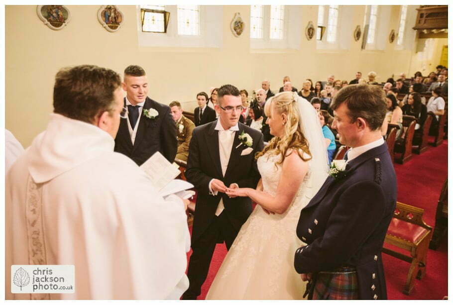 Manchester Wedding Photographer St Anne's Church Wedding Photographer Dukinfield Town Hall Wedding Photography by Chris & Hazel Katrina & John 043 bride and groom exchange rings vows church St Annes church St. Anne's church openshaw wedding photographer by Manchester Wedding Photographer Chris & Hazel