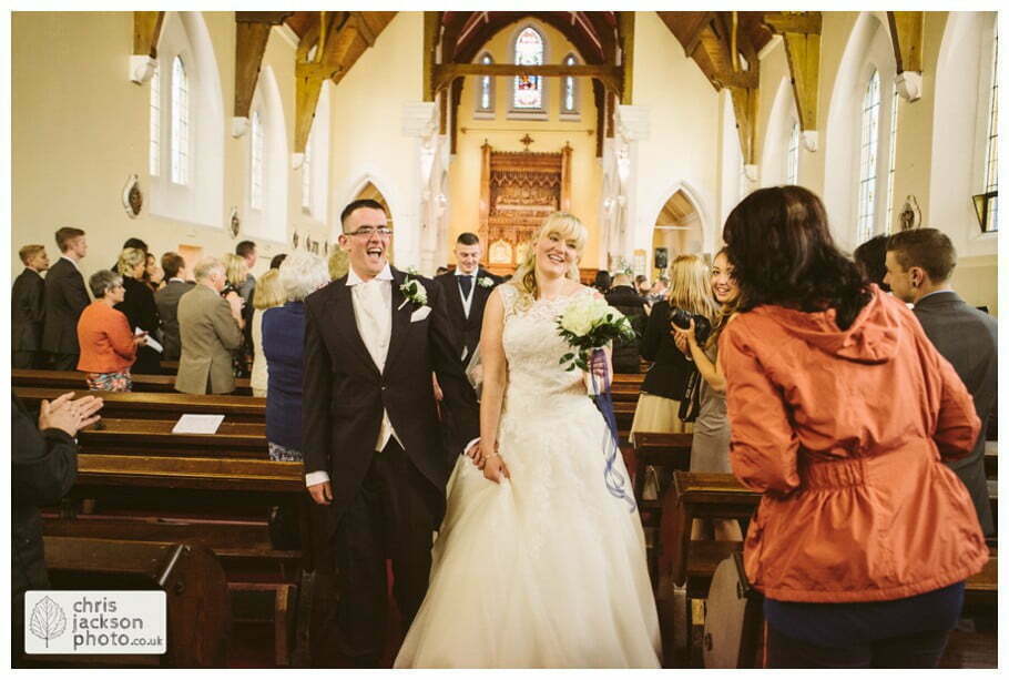 Manchester Wedding Photographer St Anne's Church Wedding Photographer Dukinfield Town Hall Wedding Photography by Chris & Hazel Katrina & John 052 bride and groom walking up aisle out of church St Annes church St. Anne's church openshaw wedding photographer by Manchester Wedding Photographer Chris & Hazel