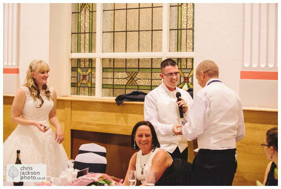 Manchester Wedding Photographer St Anne's Church Wedding Photographer Dukinfield Town Hall Wedding Photography by Chris & Hazel Katrina & John 117 groom speech documentary reaction shot Dukinfield Town Hall wedding photographer by Manchester Wedding Photographer Chris & Hazel