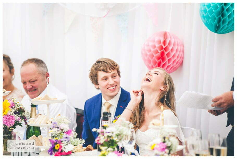 bride and groom laugh reaction to father of the bride wedding speech inside The venue at Wimberry hill wedding day diy vintage wedding glossop The venue at wimberry hill glossop wedding photography by Glossop wedding photographers chris and hazel natasha thorley jake rowarth