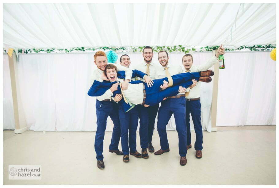 rain raining indoor wedding formal family photography groom lifted lifting up ushers best man creative wedding formal inside The venue at Wimberry hill wedding day diy vintage wedding glossop The venue at wimberry hill glossop wedding photography by Glossop wedding photographers chris and hazel natasha thorley jake rowarth