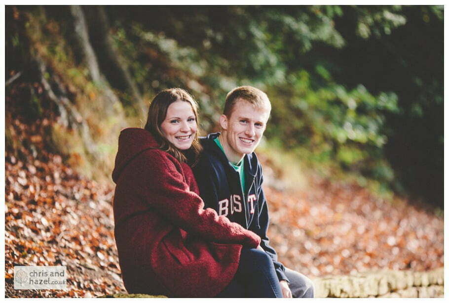Rippon engagement photography wedding photographer Fountains Abbey yorkshire wedding photographer chris and hazel ruins couple saw on wall autumn orange leaves