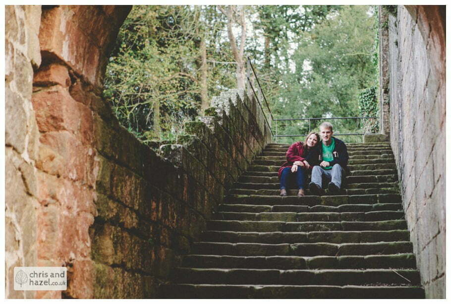 Rippon engagement photography wedding photographer Fountains Abbey yorkshire wedding photographer chris and hazel ruins couple sat on steps inside ruins