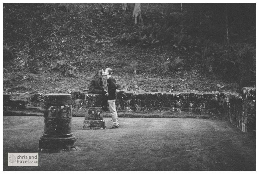 Rippon engagement photography wedding photographer Fountains Abbey yorkshire wedding photographer chris and hazel ruins couple sat on ruins