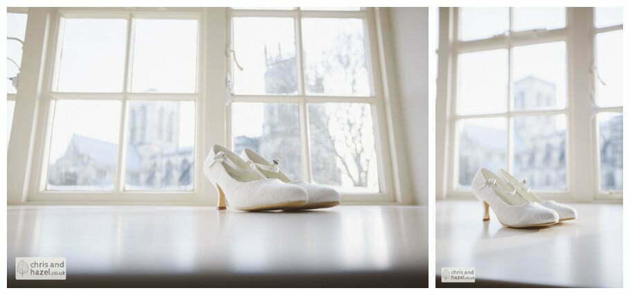 wedding shoes with york minister in background getting ready preparations york city centre documentary wedding photography ben frankie wedding photographer york wedding photography wedding winter chris and hazel wedding photography york