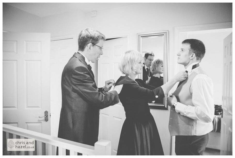 groom with father and mother getting ready preparations york city centre documentary wedding photography ben c frankie wedding photographer york wedding photography wedding winter chris and hazel wedding photography york