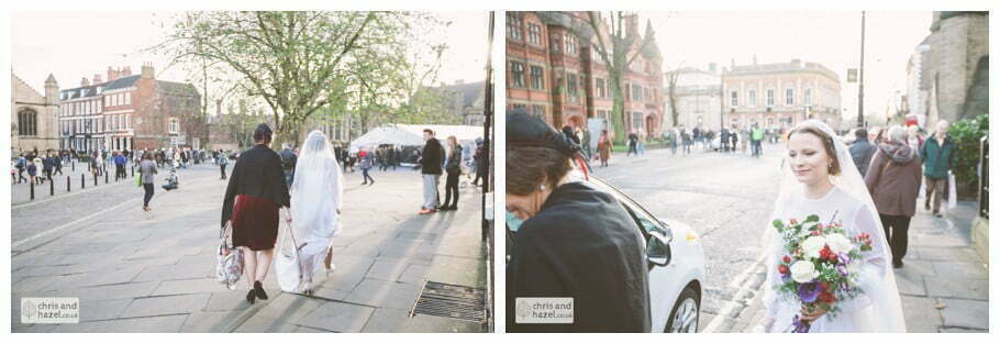 bride walking through york city centre in wedding dress ben frankie wedding photographer york wedding photography bride and groom christmas wedding winter chris and hazel wedding photography york