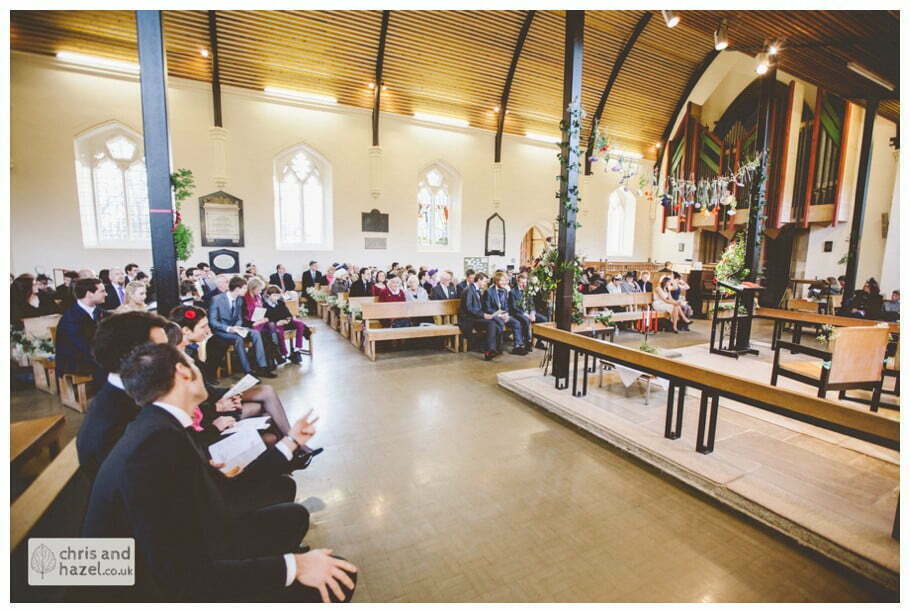 guests inside heslington church documentary wedding photography ben frankie wedding photographer heslington church wedding york wedding photography wedding winter chris and hazel wedding photography york