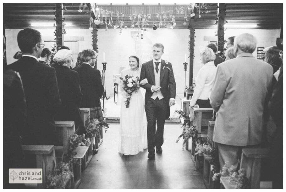 bride and groom walking down aisle heslington church ben frankie bride groom wedding photographer heslington church wedding york wedding photography bride wedding winter chris and hazel wedding photography york