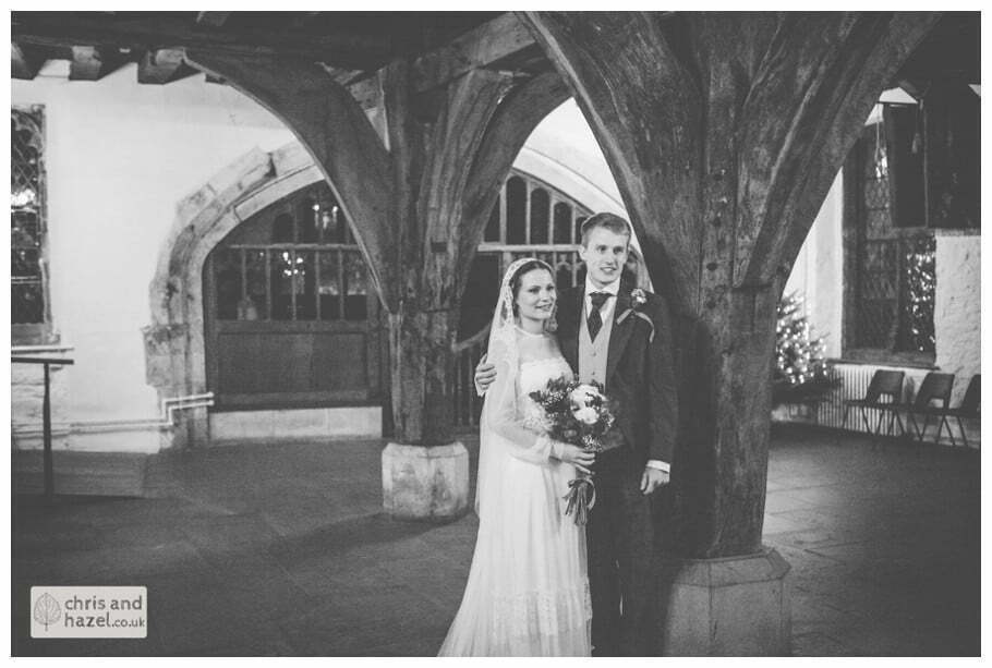 ben frankie bride groom downstairs pillar wedding photographer merchant adventurers hall york wedding photography bride and groom christmas tree wedding winter chris and hazel wedding photography york