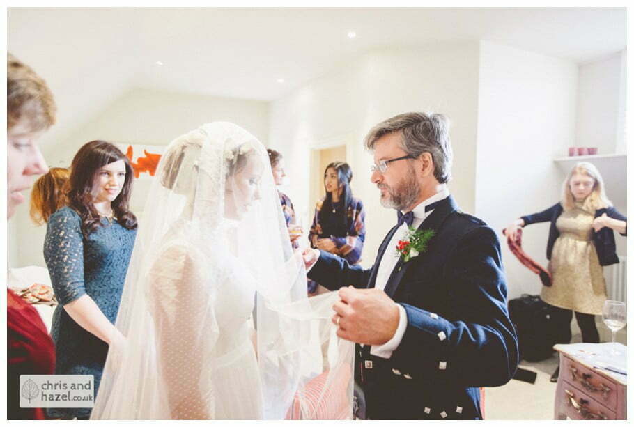 bride with father getting ready preparations the apartment at purey cust house precentors court york city centre documentary wedding photography ben frankie wedding photographer york wedding photography wedding winter chris and hazel wedding photography york