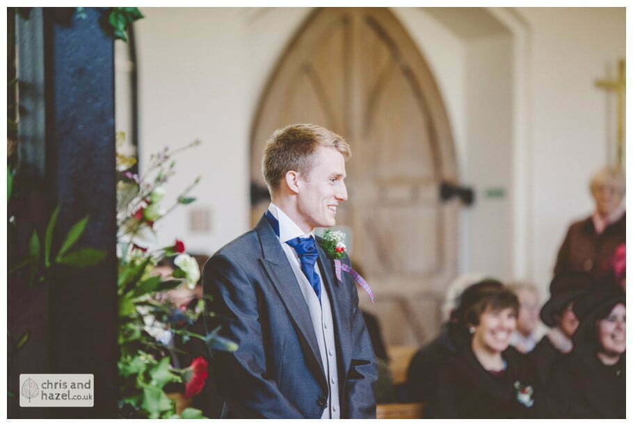 groom waiting at alter heslington church documentary wedding photography ben frankie wedding photographer heslington church wedding york wedding photography wedding winter chris and hazel wedding photography york