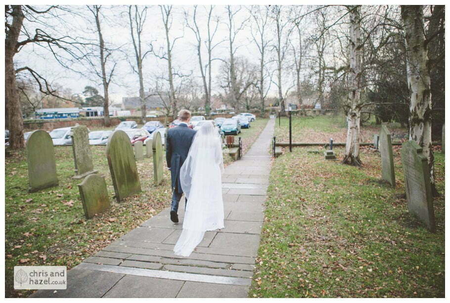 bride and groom outside heslington church ben frankie bride groom wedding photographer heslington church wedding york wedding photography bride wedding winter chris and hazel wedding photography york