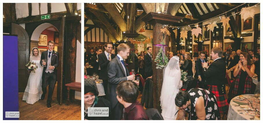 bride and groom announced into room ben frankie merchant adventurers hall york wedding photography bride and groom christmas wedding winter chris and hazel wedding photography york