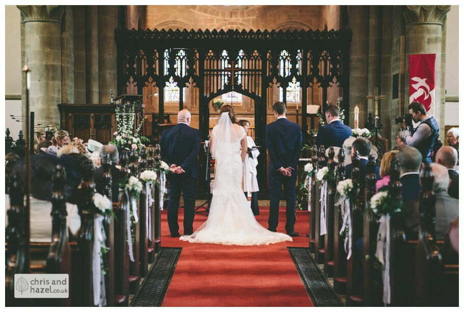 bride and groom at front of church altar ceremony Whitly Church wedding Dewsbury Wedding Photographer Whitly Chris and Hazel Wedding Photography Steven Mountford Rachel Moore