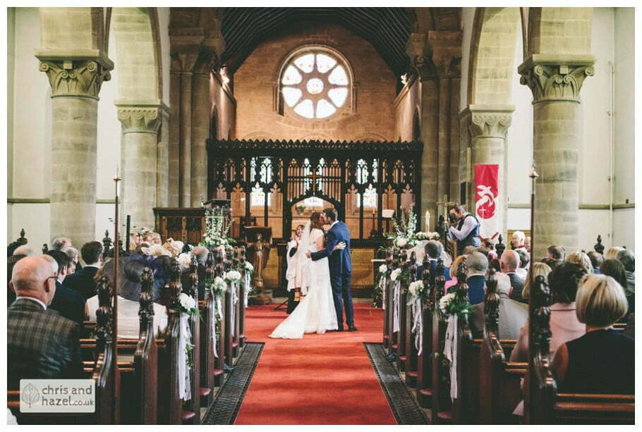 vows first kiss bride and groom at front of church altar ceremony Whitly Church wedding Dewsbury Wedding Photographer Whitly Chris and Hazel Wedding Photography Steven Mountford Rachel Moore