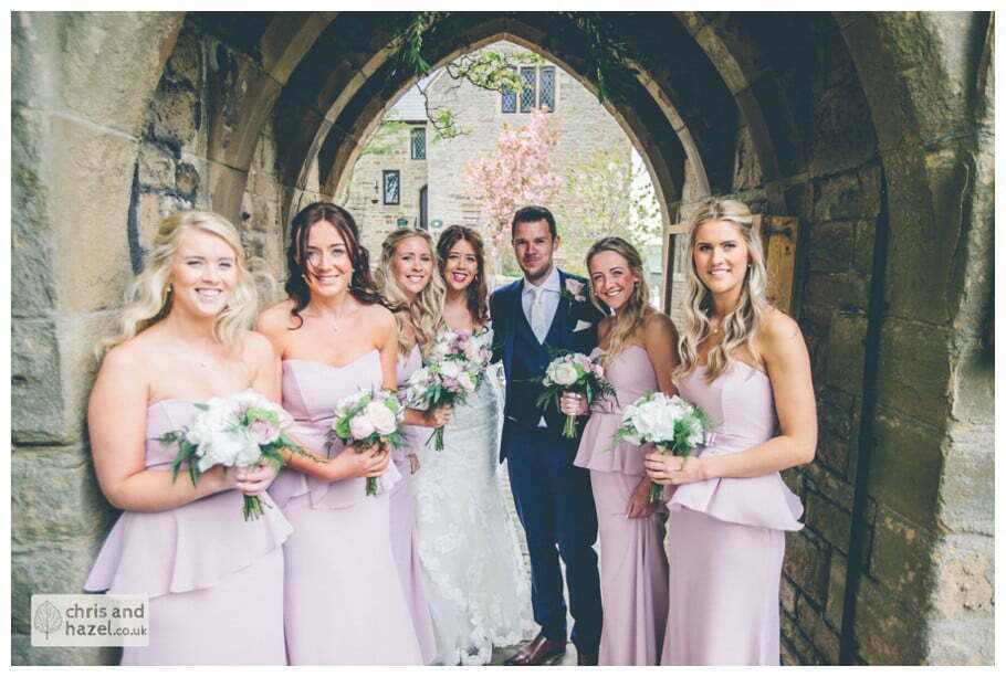 bride and groom with bridesmaids outside Whitly Church wedding Dewsbury Wedding Photographer Whitly Chris and Hazel Wedding Photography Steven Mountford Rachel Moore