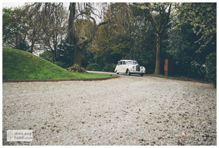bride and groom in wedding car austin princess vanden plas 1961 Woodlands hotel Wedding Photographer leeds wedding photography Chris and Hazel Wedding Photography Steven Mountford Rachel Moore