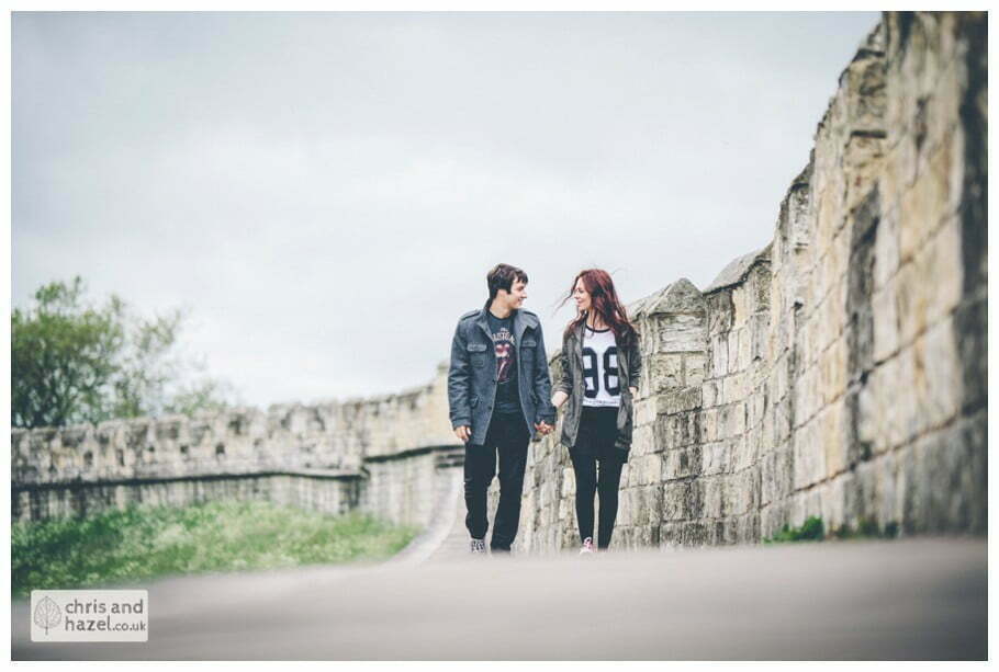 couple walking york walls Engagement photography York walls pre wedding photographer york chris and hazel wedding photography jonny dunn stef brown