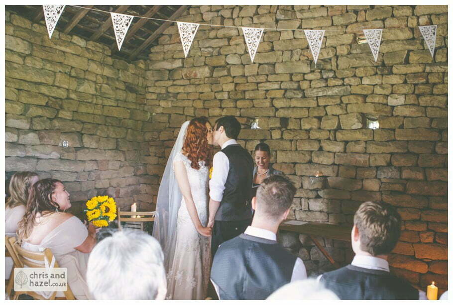 bride and groom at altar humanist wedding ceremony in barn documentary Wedding Photographer Harrogate Wedding Photography Braisty Estate by Chris and Hazel Wedding Photography Jonny Dunn Stef Brown