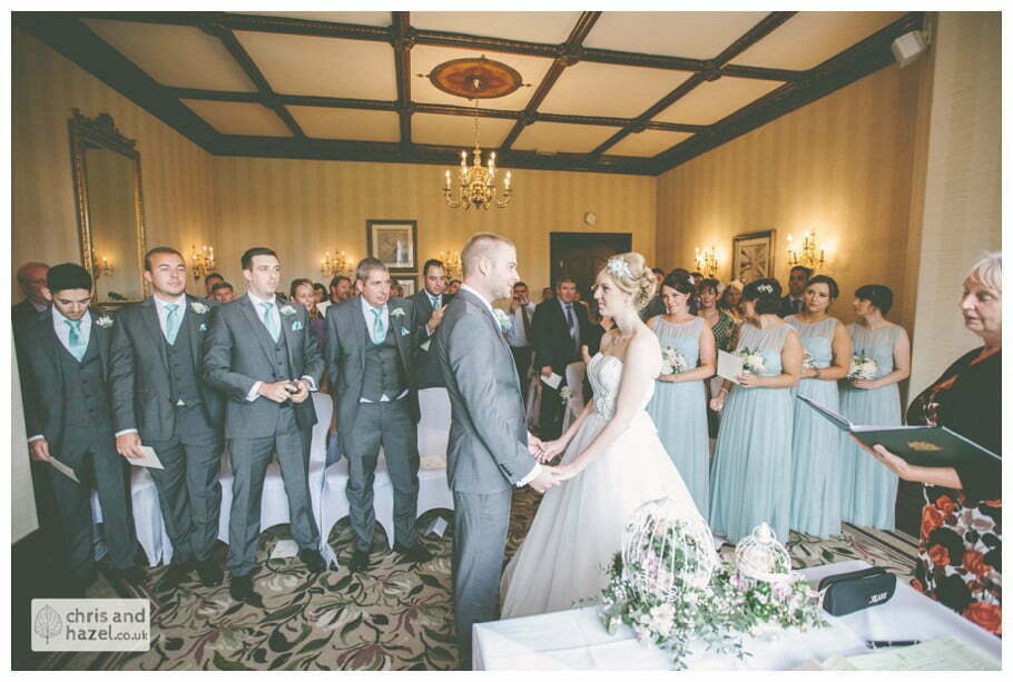bride and groom at altar wedding ceremony kenwood hall documentary Sheffield Wedding Photographer Kenwood Hall Wedding Photography Sheffield by Chris and Hazel Wedding Photography Glen Briddock Emily Shaw