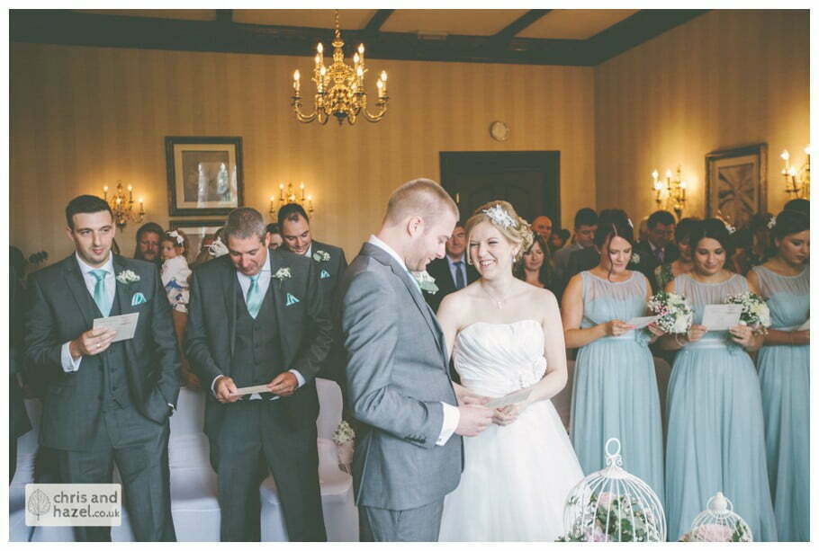 bride and groom at altar wedding ceremony kenwood hall documentary Sheffield Wedding Photographer Kenwood Hall Wedding Photography Sheffield by Chris and Hazel Wedding Photography Glen Briddock Emily Shaw