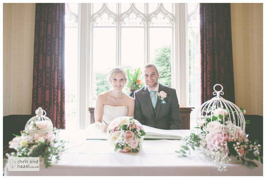 bride and groom sign register wedding ceremony kenwood hall documentary Sheffield Wedding Photographer Kenwood Hall Wedding Photography Sheffield by Chris and Hazel Wedding Photography Glen Briddock Emily Shaw