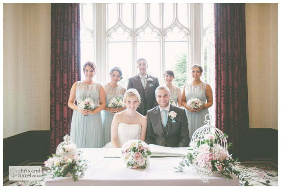 bride and groom sign register wedding ceremony kenwood hall documentary Sheffield Wedding Photographer Kenwood Hall Wedding Photography Sheffield by Chris and Hazel Wedding Photography Glen Briddock Emily Shaw