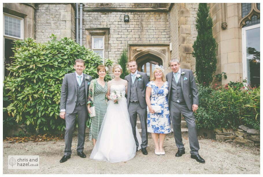 bride and groom with parents formal family photograph outside kenwood hall documentary Sheffield Wedding Photographer Kenwood Hall Wedding Photography Sheffield by Chris and Hazel Wedding Photography Glen Briddock Emily Shaw