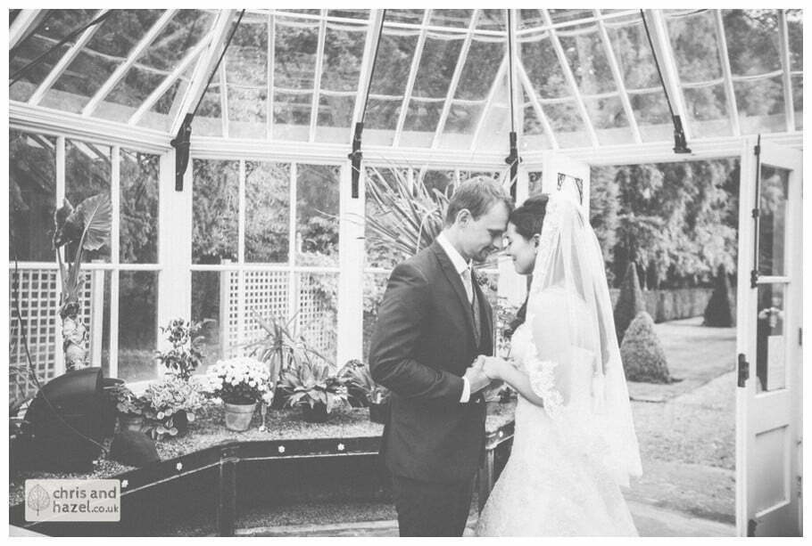 bride and groom vows wedding ceremony in greenhouse conservatory documentary Hull Wedding Photographer Bishop Burton College Wedding Photography Hull by Chris and Hazel Wedding Photography Ross laurelin Matulis