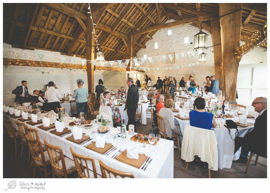 guests sitting down for wedding breakfast, barn wedding breakfast, rustic, vintage, documentary wedding photography, Keighley ,Wedding Photographer, East Riddlesden Hall, Wedding Photography, Chris and Hazel Wedding Photography, Craig beasley, Stephanie Stubbs,