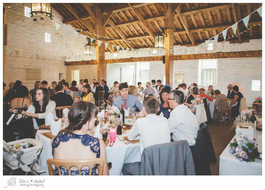 guests sitting down for wedding breakfast, barn wedding breakfast, rustic, vintage, documentary wedding photography, Keighley ,Wedding Photographer, East Riddlesden Hall, Wedding Photography, Chris and Hazel Wedding Photography, Craig beasley, Stephanie Stubbs,
