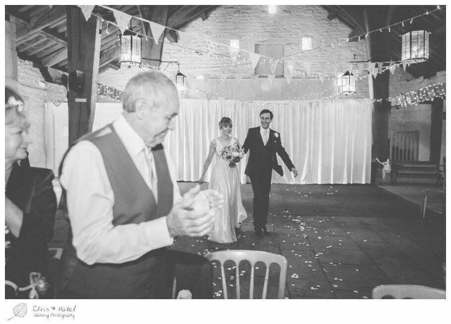 bride and groom sitting down for wedding breakfast, barn wedding breakfast, rustic, vintage, documentary wedding photography, Keighley ,Wedding Photographer, East Riddlesden Hall, Wedding Photography, Chris and Hazel Wedding Photography, Craig beasley, Stephanie Stubbs,