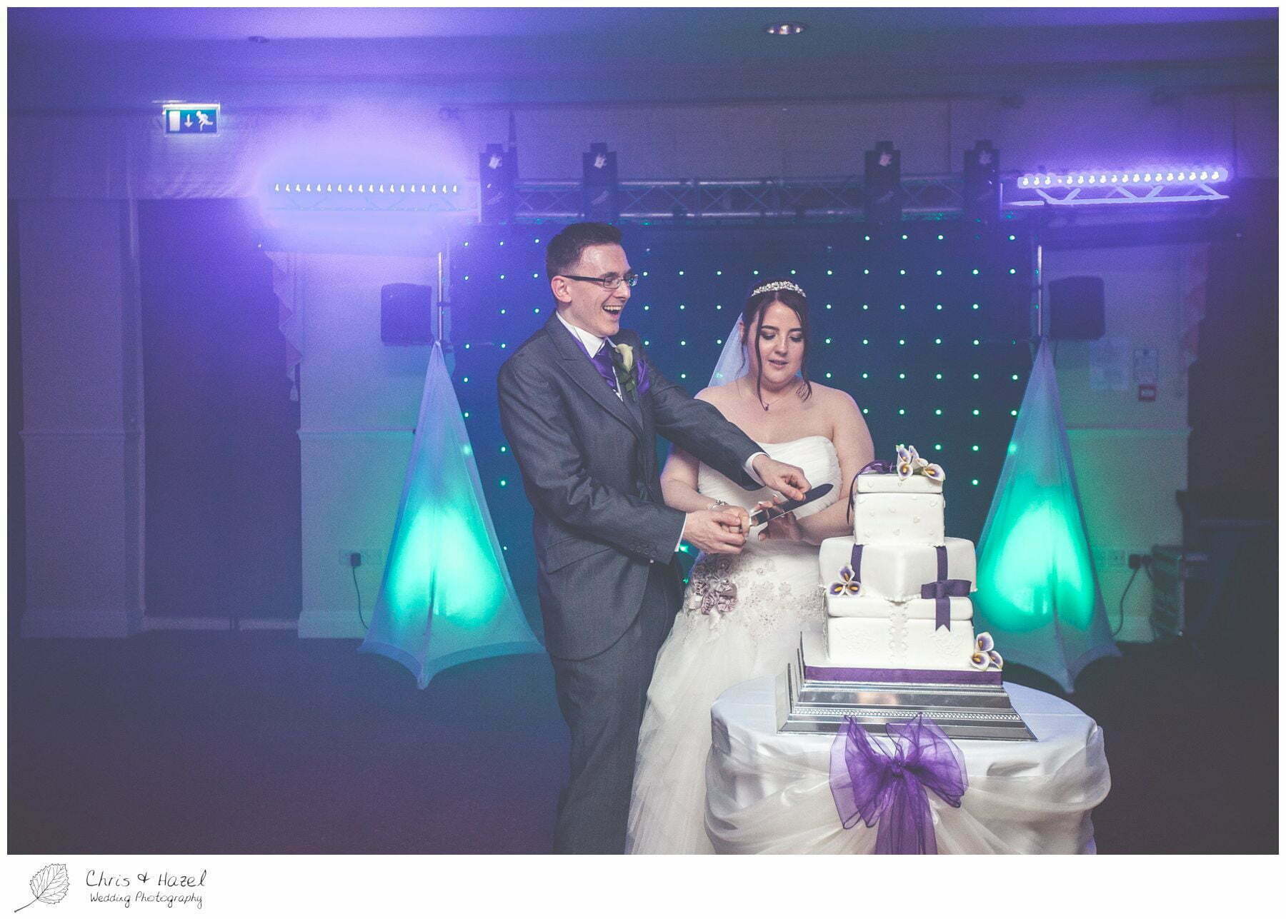 bride and groom cake cut cutting before first dance on dance floor, bagden hall wedding venue, documentary wedding photography, denny dale, huddersfield, Wedding Photographer, Bagden Hall, Wedding Photography, Chris and Hazel Wedding Photography, Alex tomenson, Vicky hunt