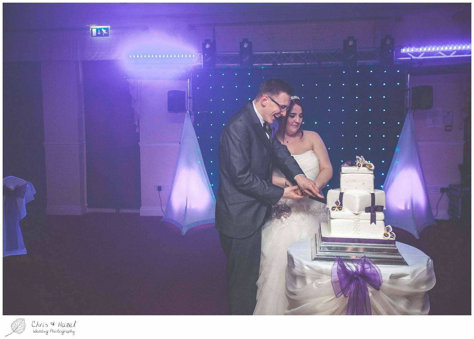 bride and groom cake cut cutting before first dance on dance floor, bagden hall wedding venue, documentary wedding photography, denny dale, huddersfield, Wedding Photographer, Bagden Hall, Wedding Photography, Chris and Hazel Wedding Photography, Alex tomenson, Vicky hunt