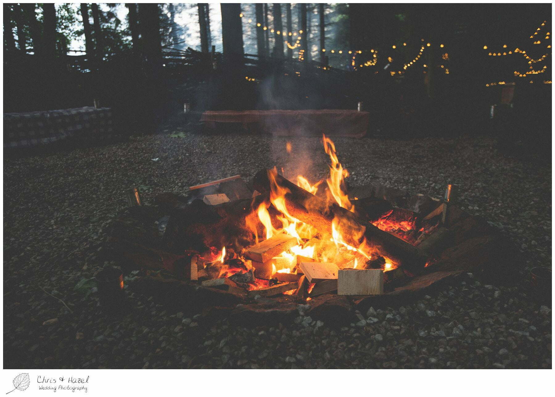 wedding fire pit, outdoor evening wedding, forest wedding reception, woodland wedding evening reception, woodland wedding, eco wedding, wedding, Eccup Wedding Photographer, Lineham Farm, Wedding Photography Leeds, Chris and Hazel Wedding Photography, Richard Wyatt, Laura Kelly