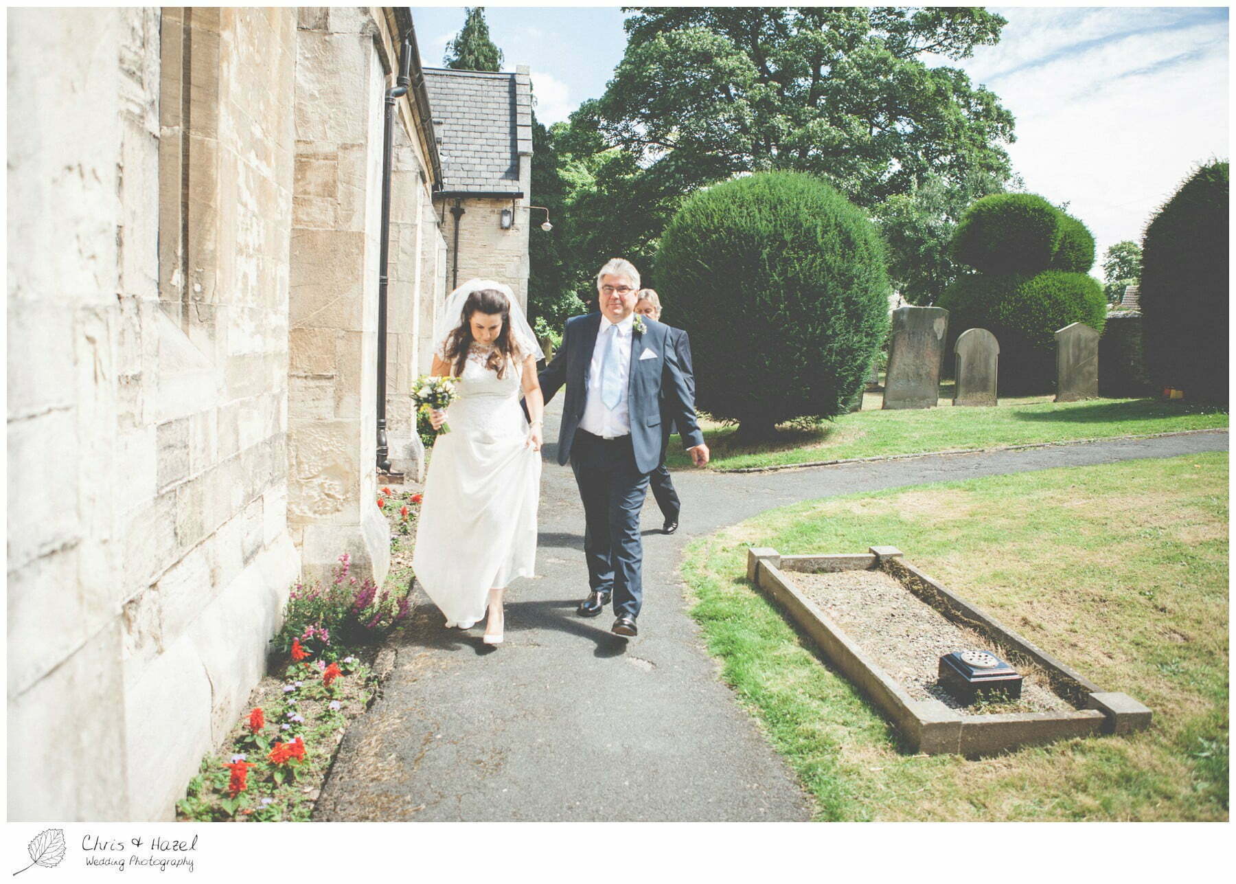 bride walking to church with father, st marys church, wedding, south milford Wedding Photographer, the engine shed, Wedding Photography wetherby, Chris and Hazel Wedding Photography, stevie pollard, stevie standerline, paul standerline,