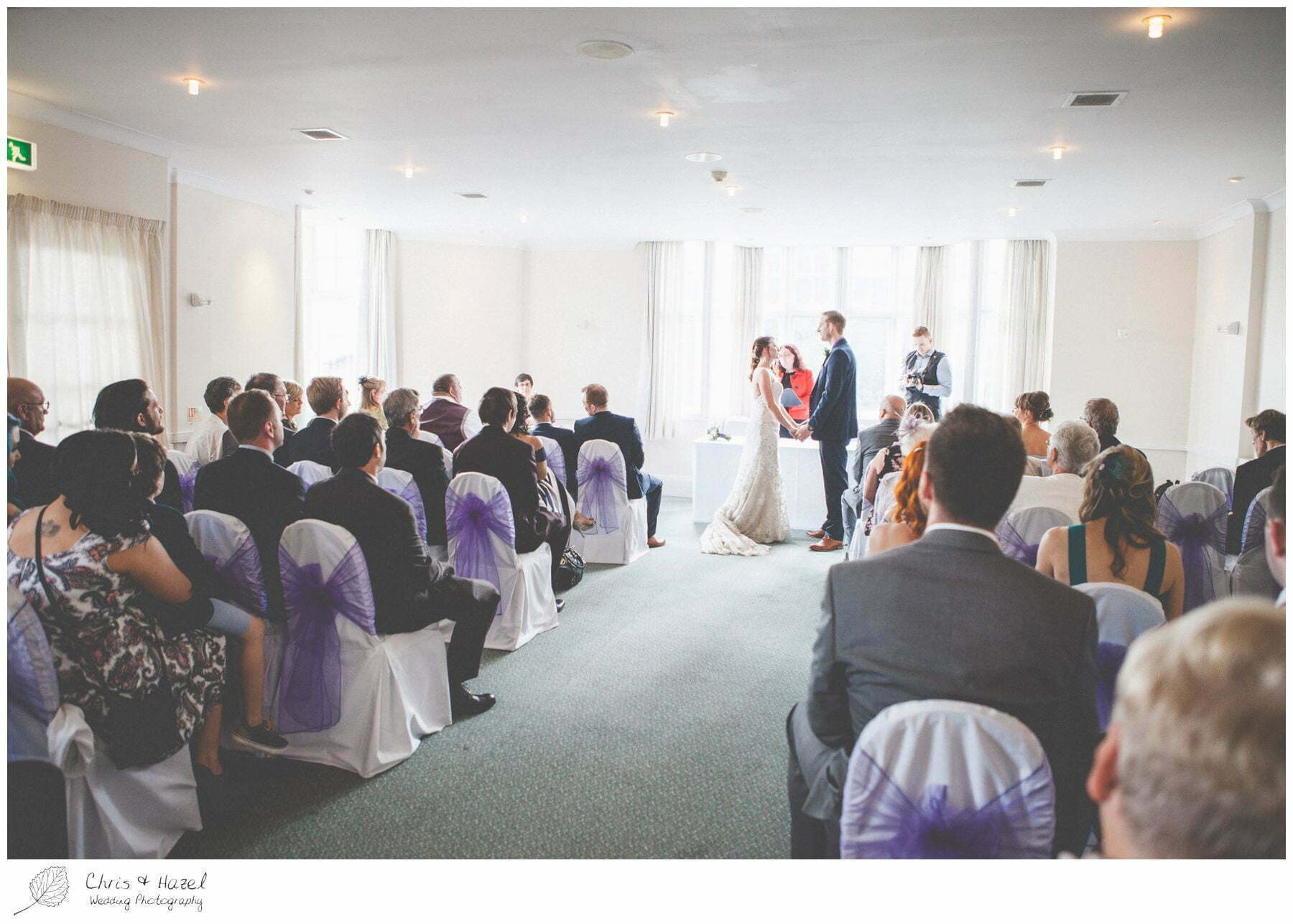 bride and groom at altar, wedding ceremony, documentary wedding photography, the cairn hotel, the cairn hotel wedding photographer, wedding photography harrogate, wedding photography yorkshire, chris and hazel wedding photography, scott Dixon, caroline ellis, caroline Dixon