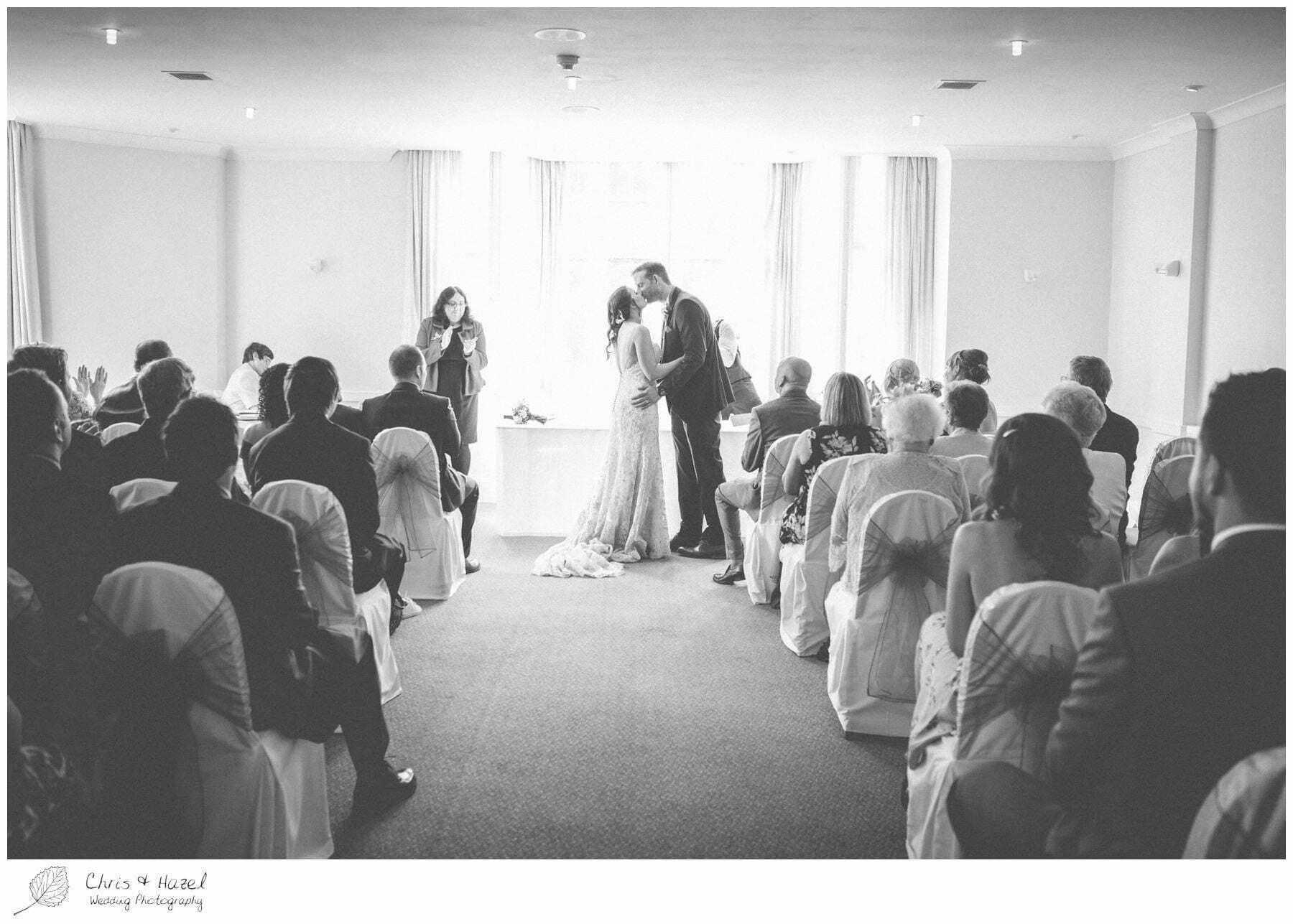 first kiss, wedding ceremony, bride and groom at altar, wedding ceremony, documentary wedding photography, the cairn hotel, the cairn hotel wedding photographer, wedding photography harrogate, wedding photography yorkshire, chris and hazel wedding photography, scott Dixon, caroline ellis, caroline Dixon